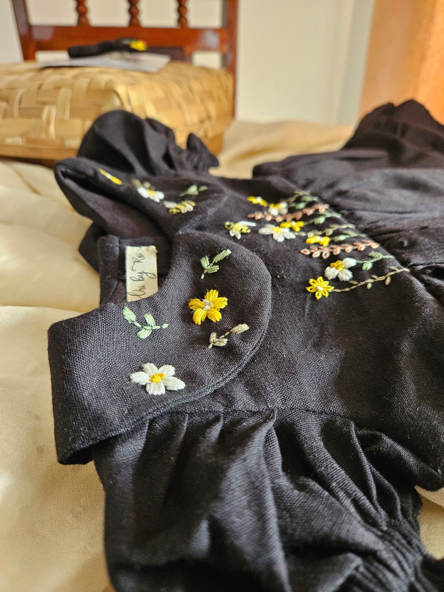 Bee Dress: Hand Embroidered Knee Length Black Dress In Moss Cotton Fabric With Bowclip
