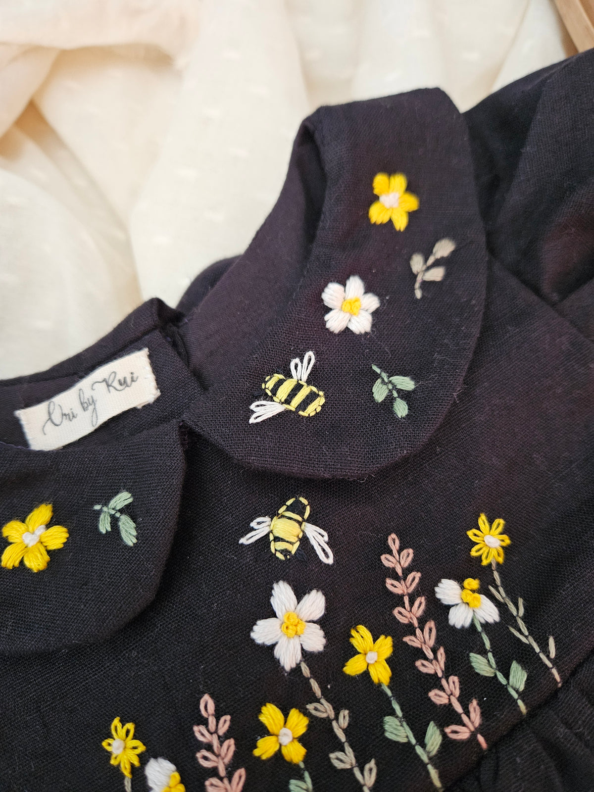 Bee Dress: Hand Embroidered Knee Length Black Dress In Moss Cotton Fabric With Bowclip