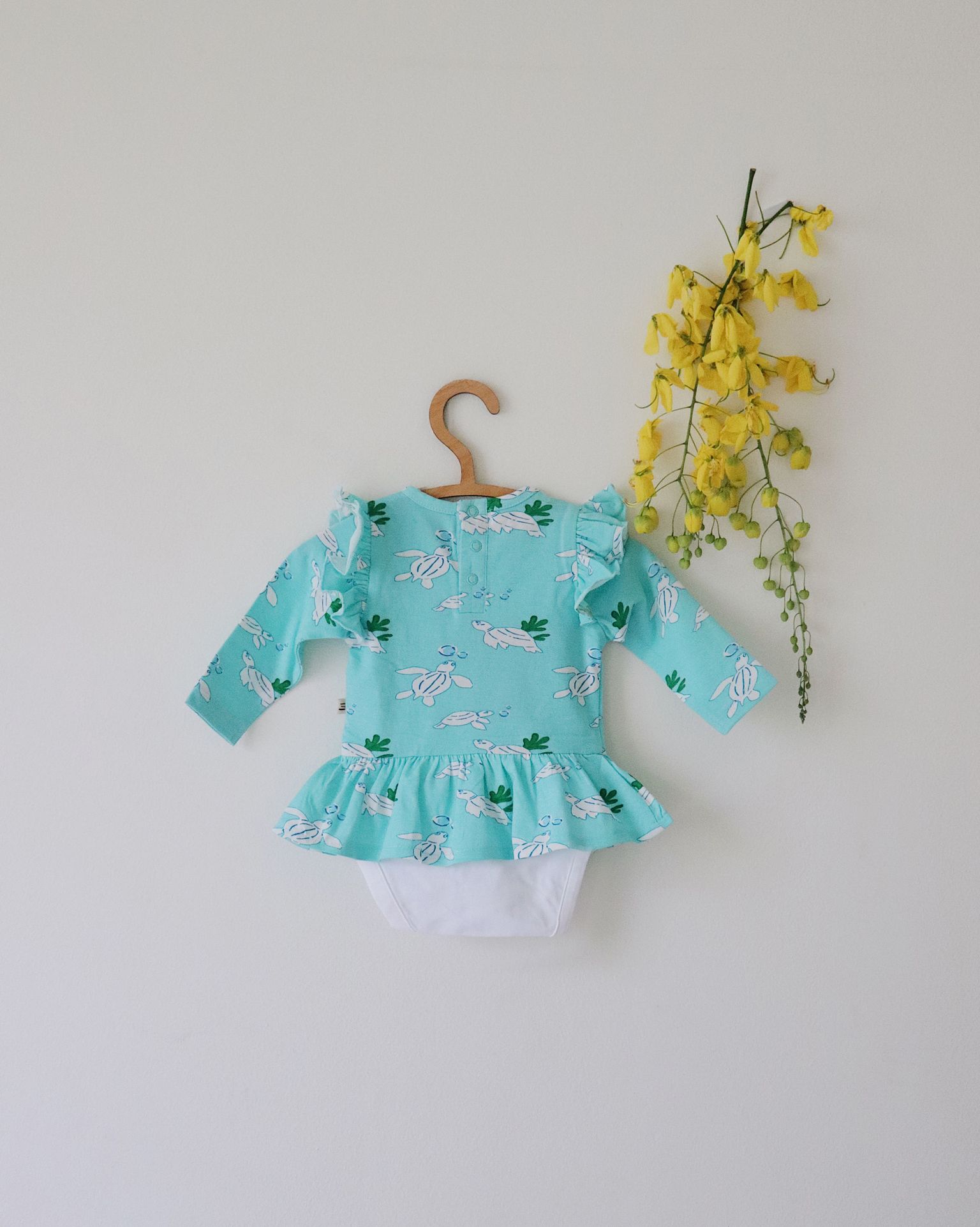 Organic Peplum Onesie (Turtle Print)