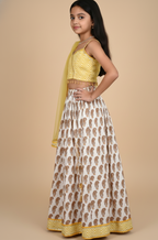 Yellow paisley lehenga with zig zag blouse and net dupatta